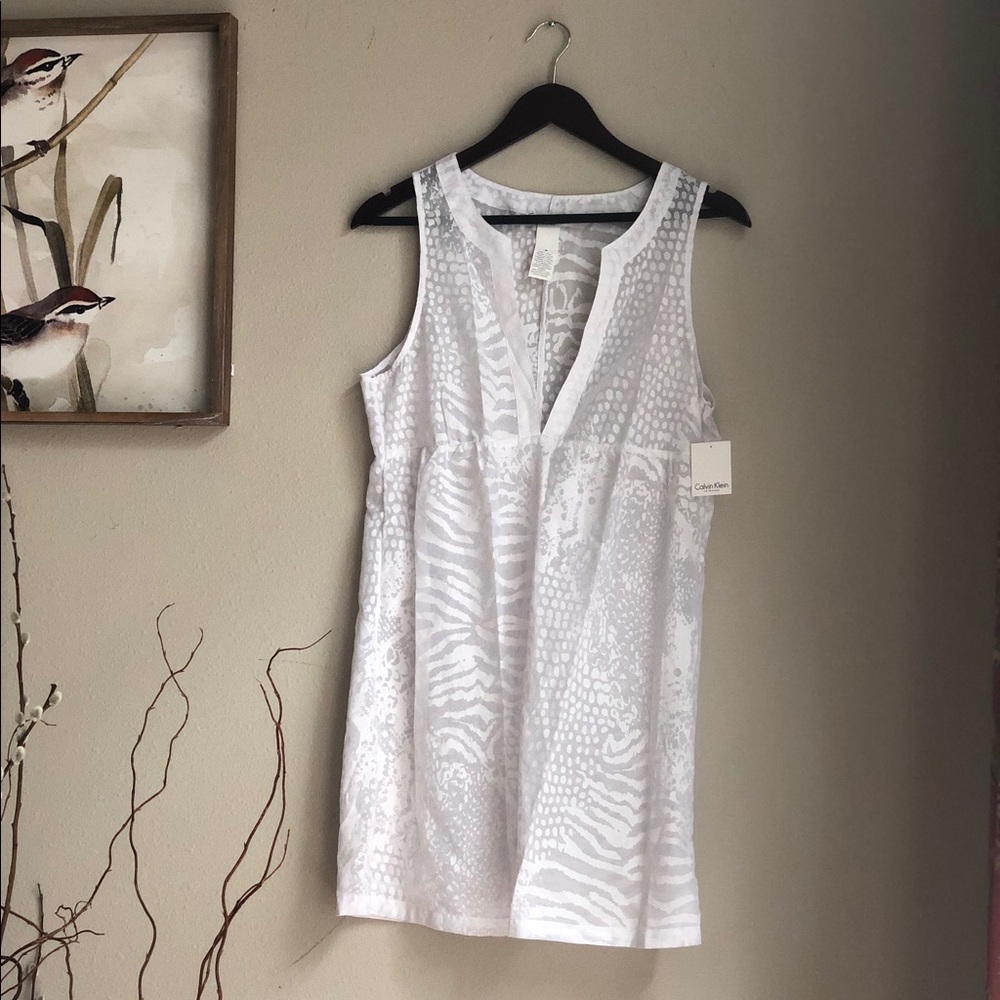 White sheer lizard print CK swimming suit coverup.